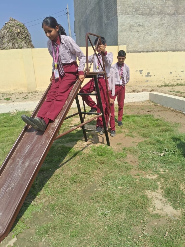 Students using the outdoor play area at Shree Sai Public School.