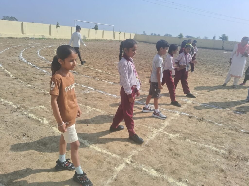 Students preparing for a race on the school sports ground.